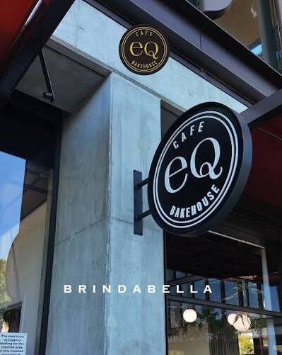 Round illuminated cafe shopfront sign